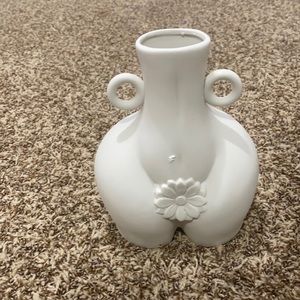 Female body art vase